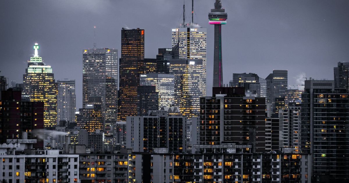 A city skyline at dusk, representing commercial real estate traded off-market