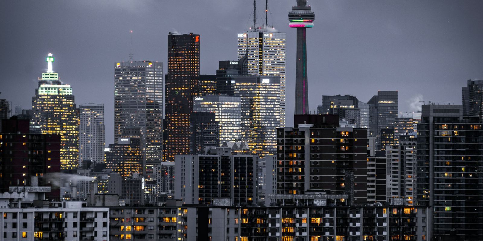 A city skyline at dusk, representing commercial real estate traded off-market